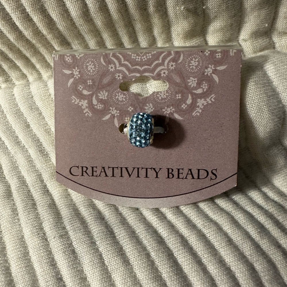 Blue Pandora-like charm